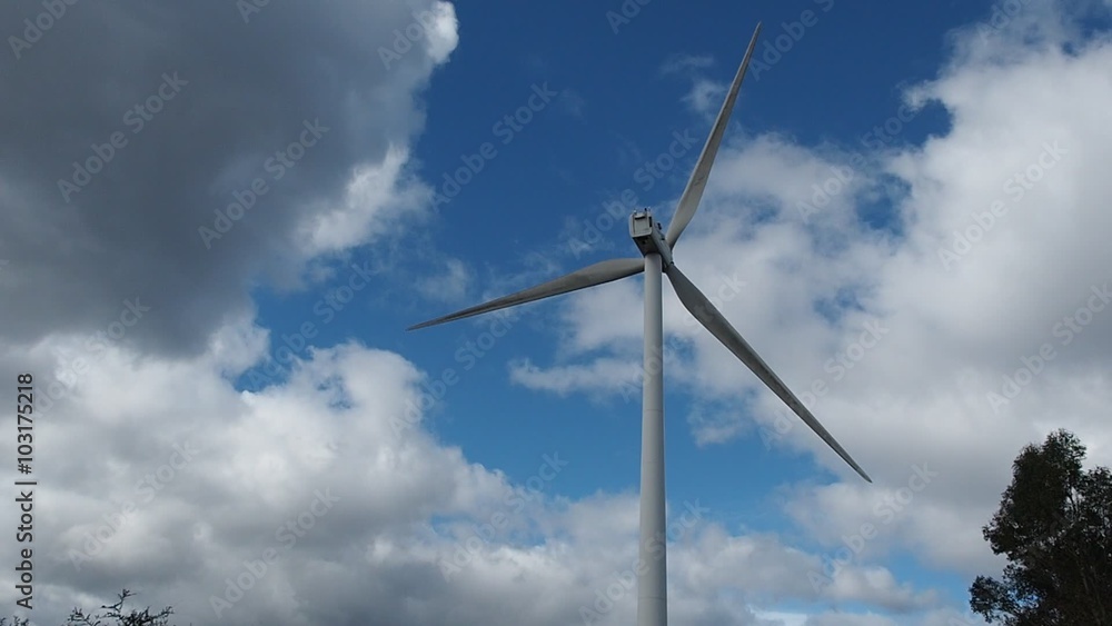 Windmill against cloudy sky Windmill against cloudy sky