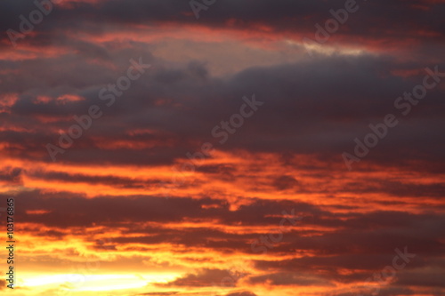 Reddish and cloudy sky at sunset in Bregenz, Austria.