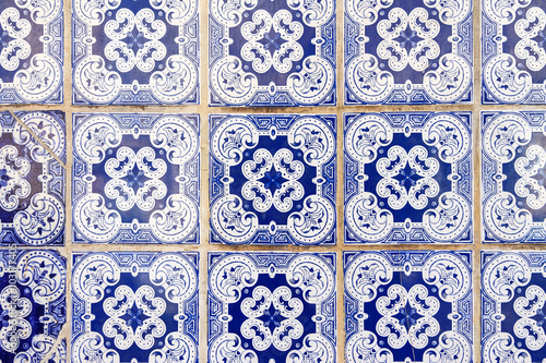 Close up image of the beautifully decorated tiles on the houses in the streets of Lisbon, Portugal