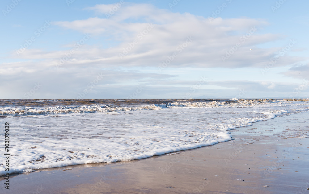 relaxing and gentle calming waves flowing into a beach at sundown relaxing and gentle calming waves flowing into a beach at sundown