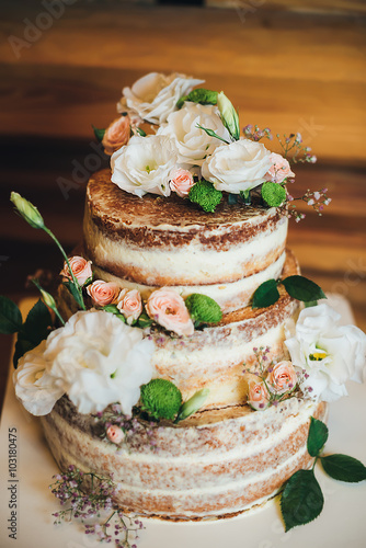Wedding cake with roses whipped cream