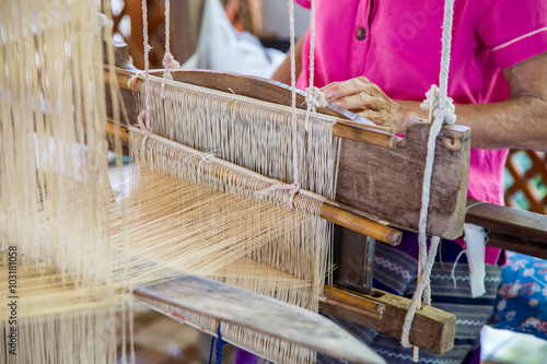 Silk weaving on loom.