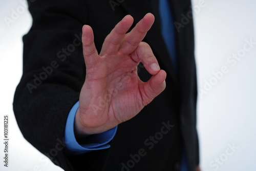 Businessman gesturing OK sign