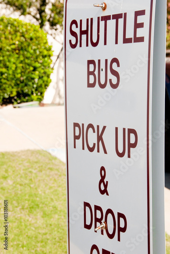 Shuttle bus pick up and drop off sign