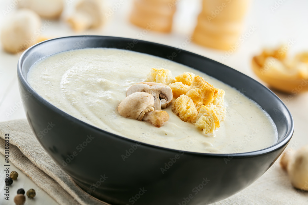Mushroom cream soup on a table, delicious French food for lunch, close-up Mushroom cream soup on a table, delicious French food for lunch, close-up