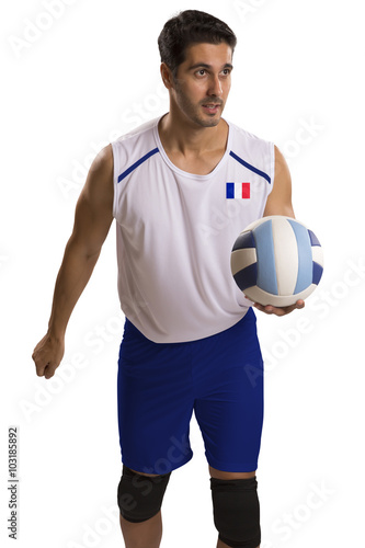 Professional French Volleyball player with ball.