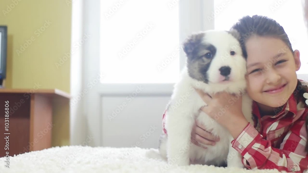 child hugging a puppy Shepherd, slow motion child hugging a puppy Shepherd, slow motion