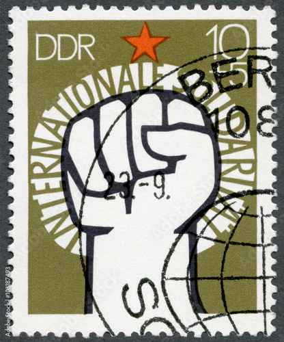 GERMANY GDR - 1973: shows Raised Fist and Star photo