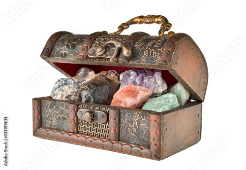 Chest of minerals. Treasures of the earth. Isolated on a white background. The picture was taken with limited depth of field. In the frame there are areas of blurring.
