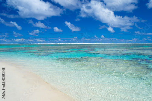 White beach on desert island in Rarotonga, Cook Islands