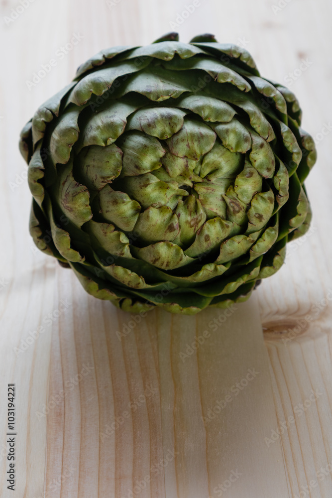 Fototapeta premium artichoke on wooden table
