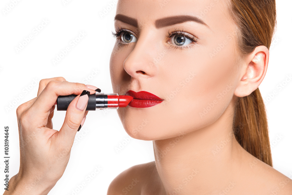 Beautiful female lips with make-up and brush Beautiful female lips with make-up and brush