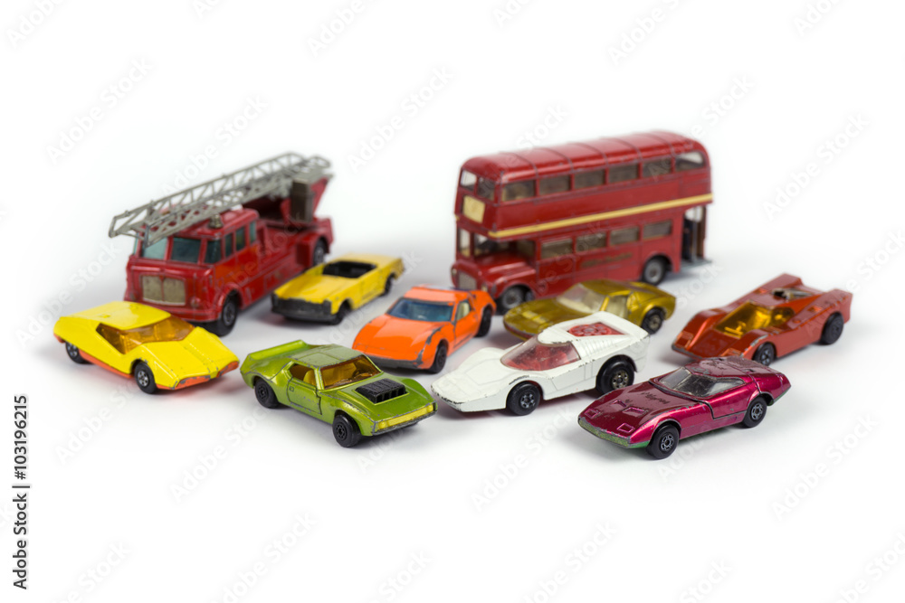 Old rusty toy cars on white background