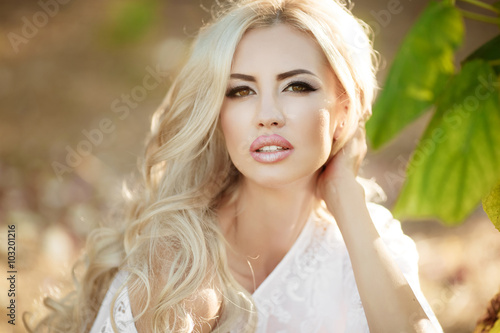 Sensual blonde woman outdoor on nature autumn