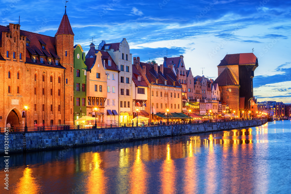 Colorful gothic facades facing Motlawa River in the old town of Gdansk, Poland, in the late evening