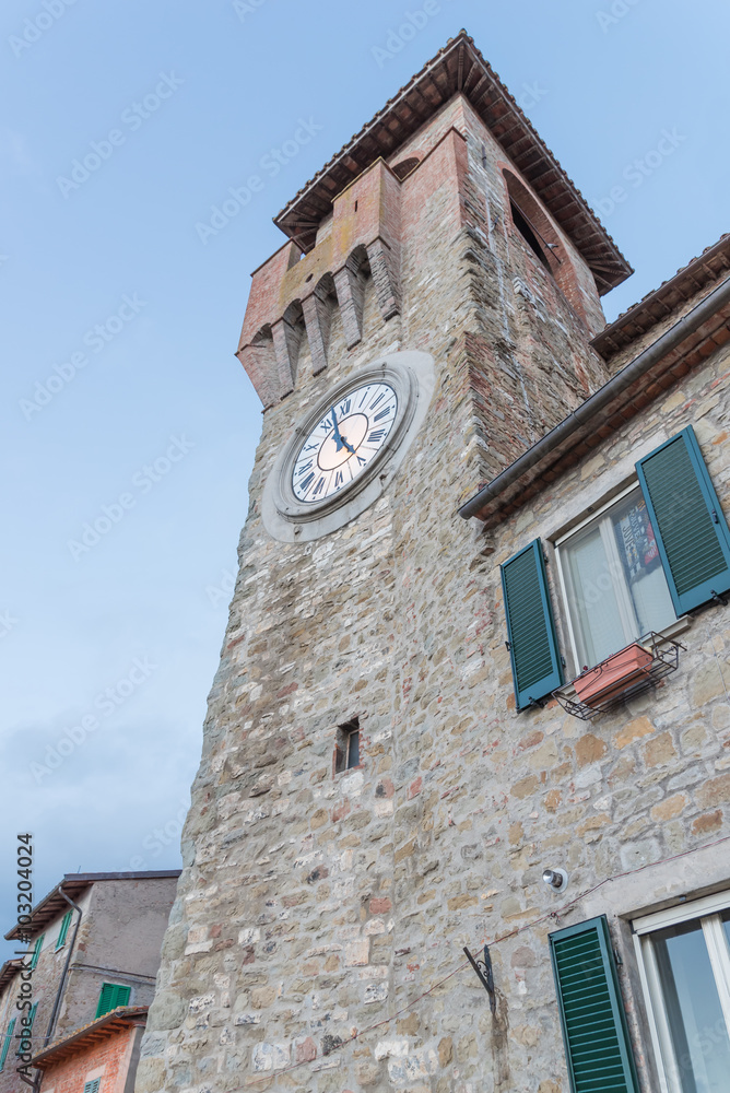 The clock tower in the historic center of Passignano - Umbria