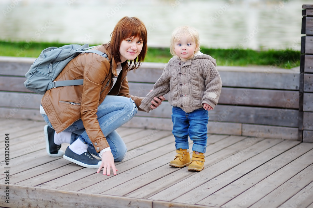 Young mother with her toddler son Young mother with her toddler son