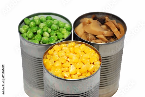 Selective focus of canned vegetables on a white background