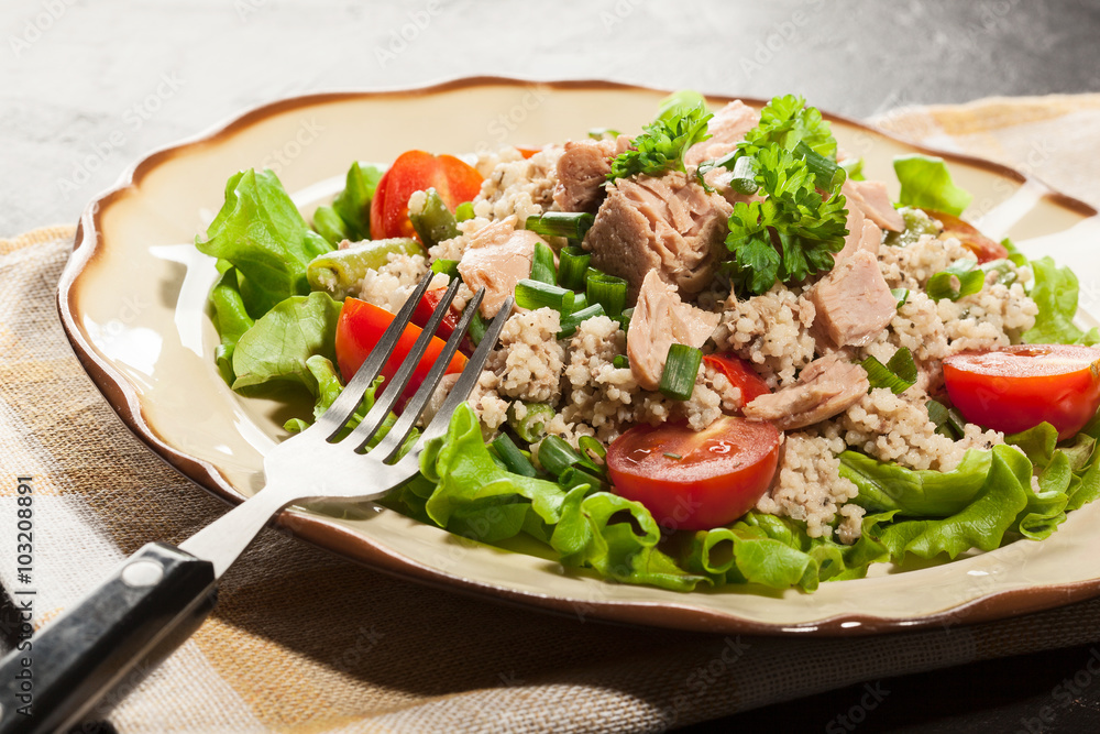 Tasty salad with couscous, tuna and vegetables