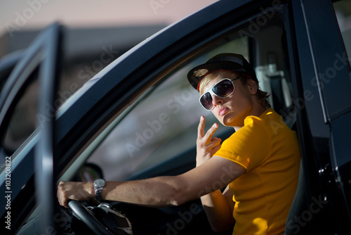 a rich guy in a car, cool dude photo
