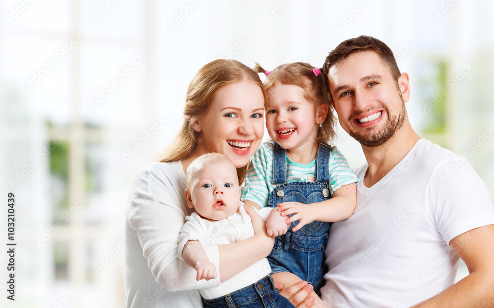 Obraz premium happy family mother, father and children at home