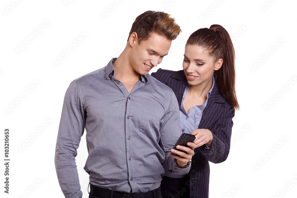 Smiling couple on phone call looking at each other on white screen Smiling couple on phone call looking at each other on white screen