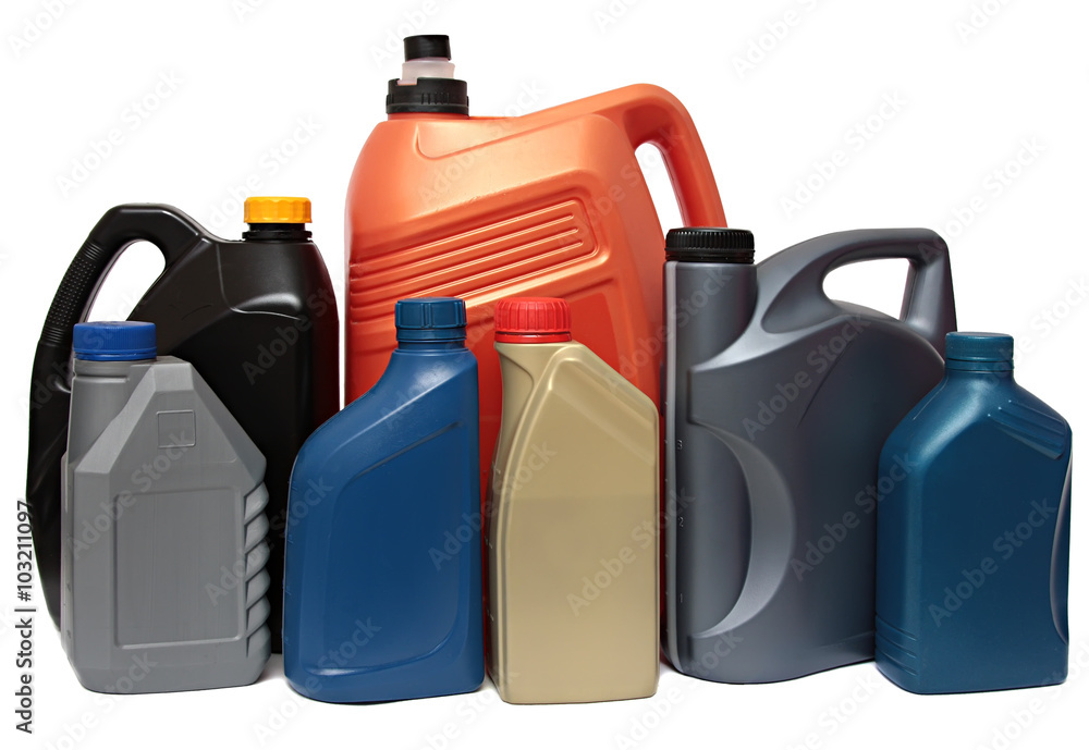Naklejka premium Plastic bottles from automobile oils isolated on white background