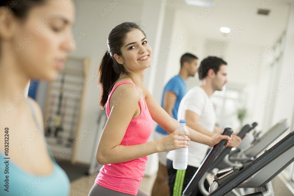 Young people training in the gym Young people training in the gym