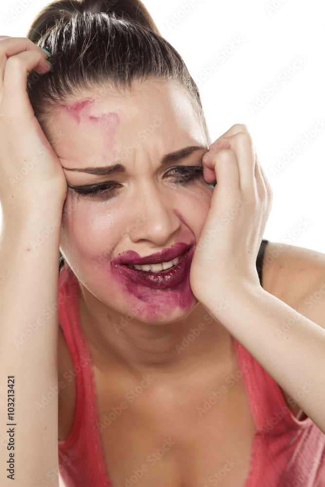 desperate and crying young woman with smeared makeup desperate and crying young woman with smeared makeup