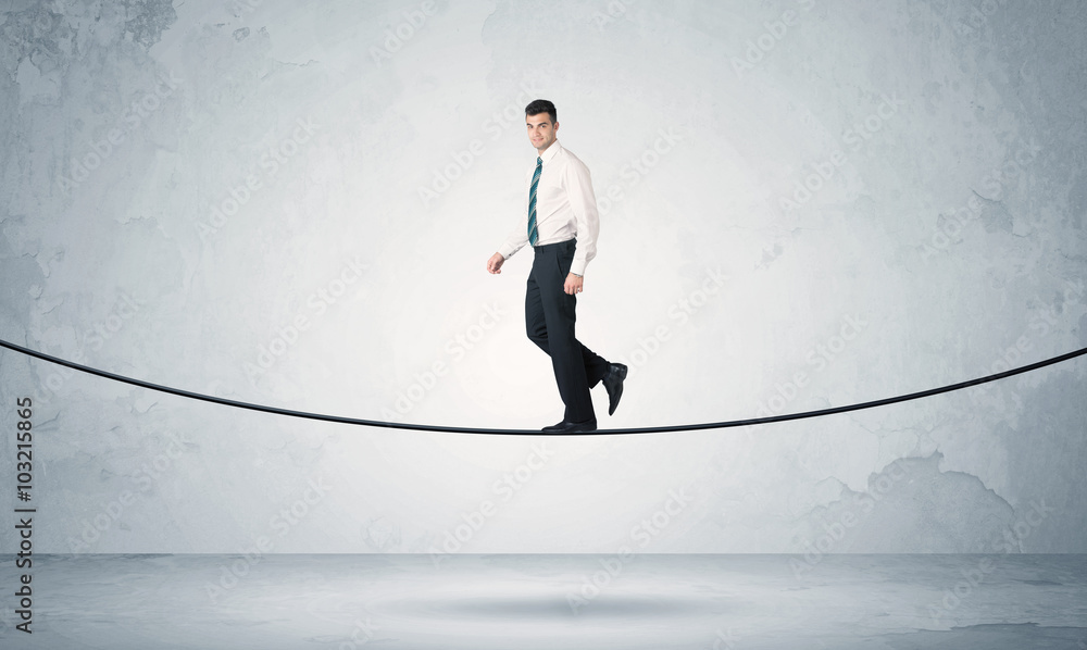 Sales guy balancing on tight rope Sales guy balancing on tight rope