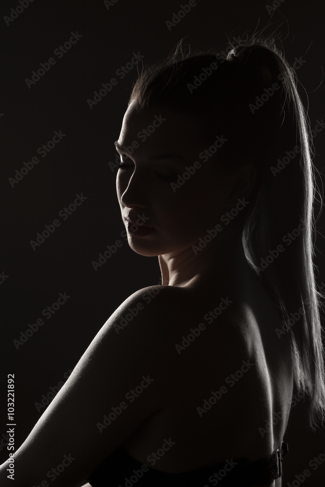 silhouette of a woman on a dark background silhouette of a woman on a dark background