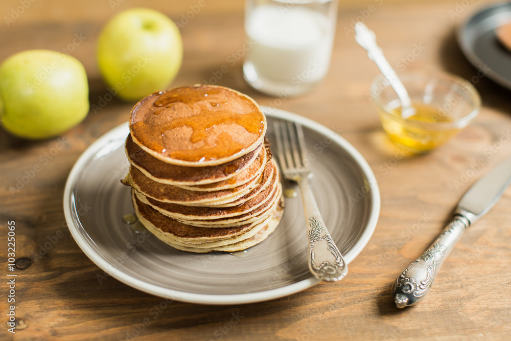 Delicious pancakes close up, with honey Delicious pancakes close up, with honey