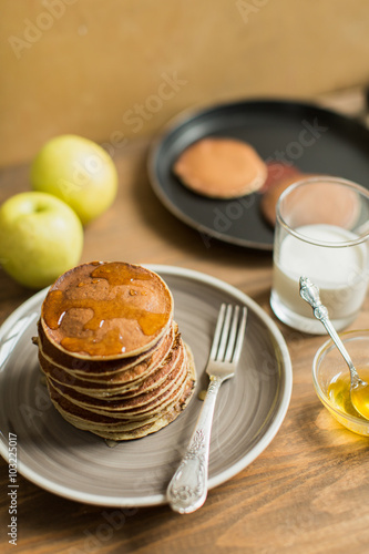 Delicious pancakes close up, with honey