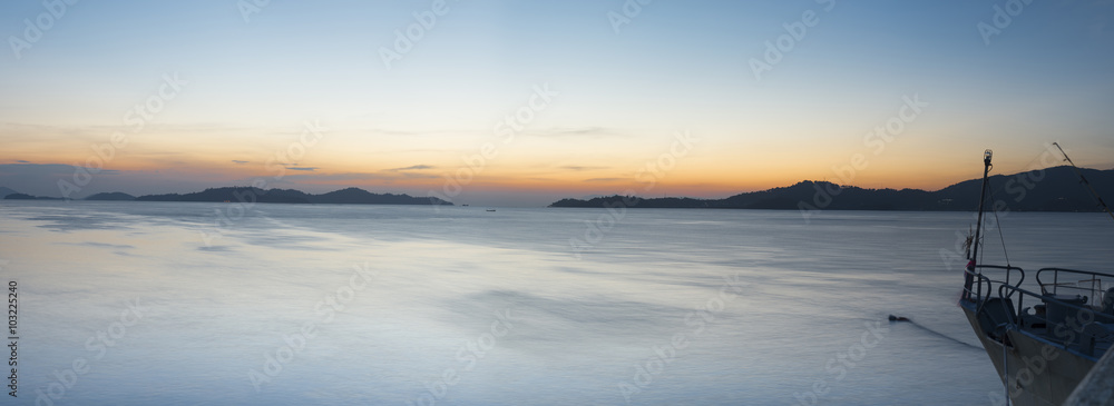 The Andaman Seascape at sunset with boat.