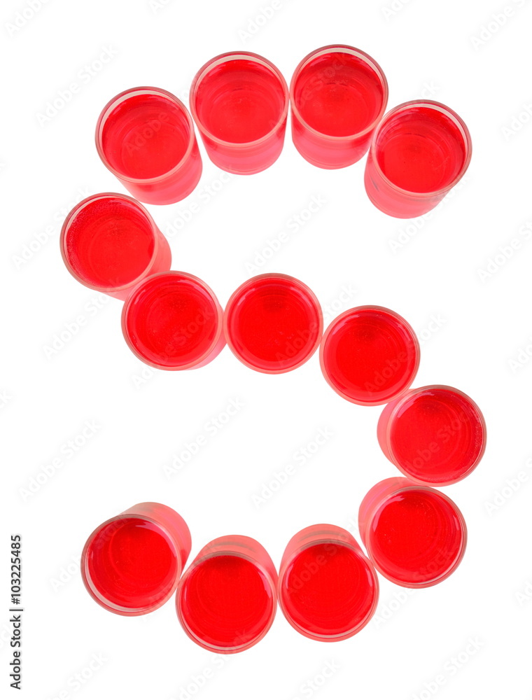 One letter of the alphabet. red drink in a glass One letter of the alphabet. red drink in a glass