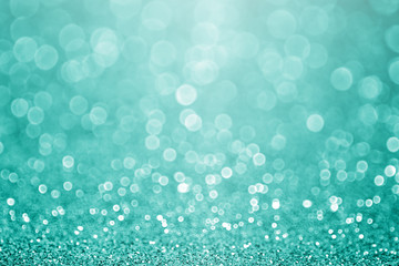 Aqua turquoise and teal green bokeh glitter sparkle background