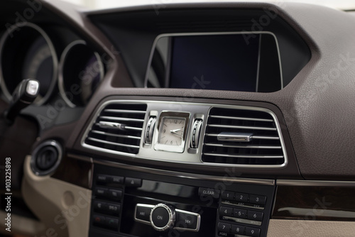 Luxury car dashboard. Interior detail.