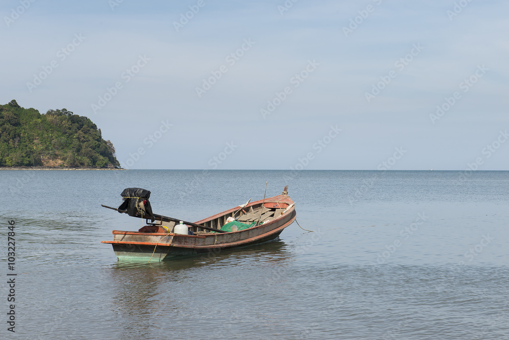 Adaman sea and wooden boat in Thailand Adaman sea and wooden boat in Thailand