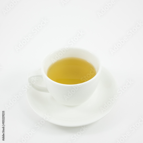 The white ceramic cup of Japanese green tea (hot drink).