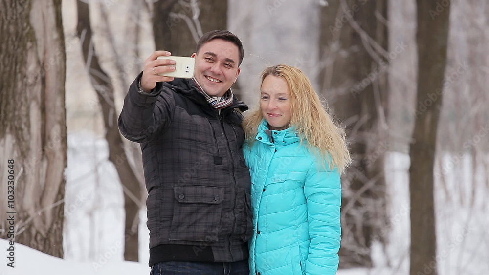 Happy couple taking selfie, winter day Happy couple taking selfie, winter day