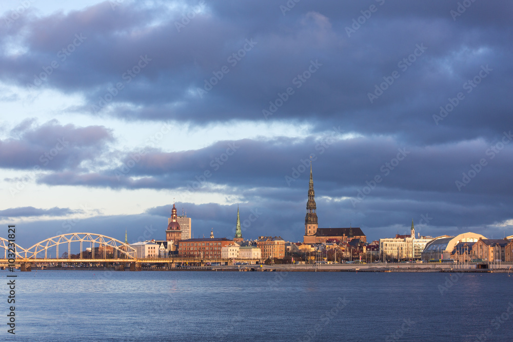 Riga, Latvia – Sunrise panorama of the town center from the Daugava river embankment - (November 21, 2015)