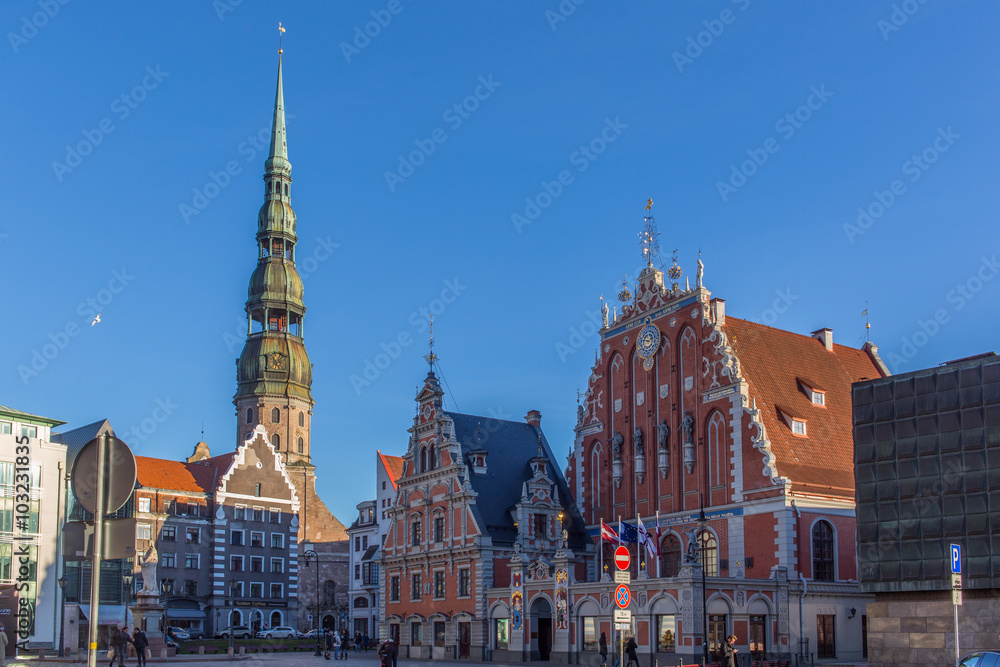 Riga, Latvia - View of the Town Hall Square with House of the Blackheads and Saint Peter church (November 21, 2015)