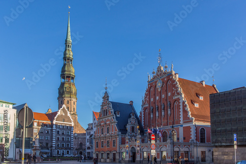 Riga, Latvia - View of the Town Hall Square with House of the Blackheads and Saint Peter church (November 21, 2015)