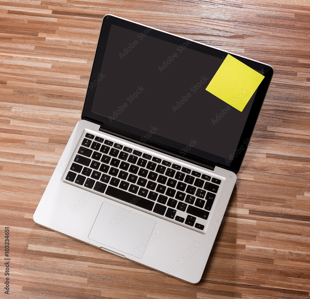 Laptop in high definition on a wood background Laptop in high definition on a wood background