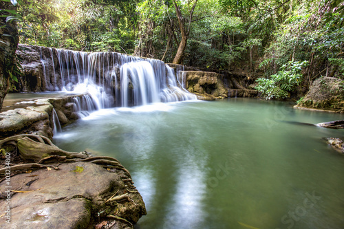 Fototapeta Naklejka Na Ścianę i Meble -  tropical waterfall in deep forest of Kanchanaburi province, Thailand.