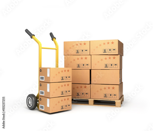 фотографія boxes lie on a pallet near the handcart isolated on white backgr
