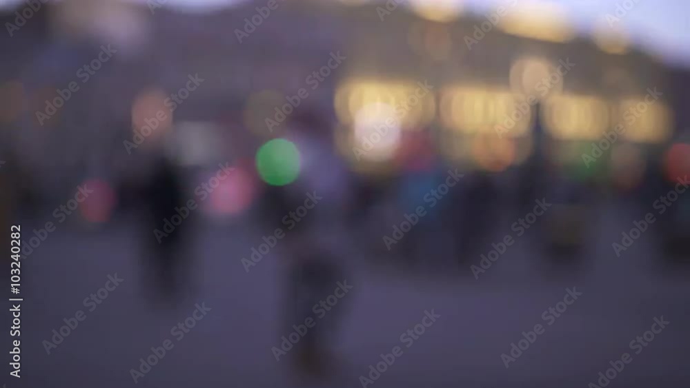 blurred background of people walking in the street or square during evening rush hour blurred background of people walking in the street or square during evening rush hour