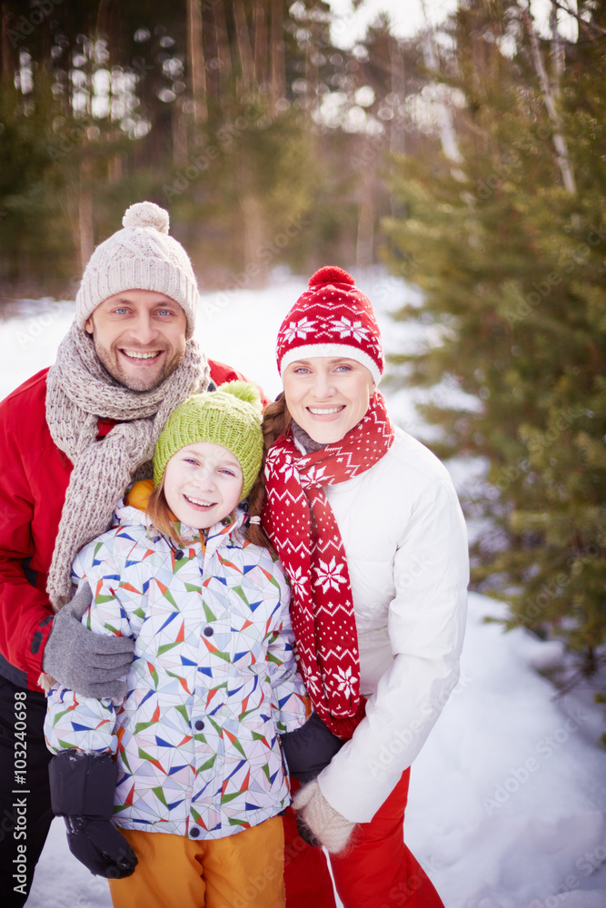 Family in winter forest