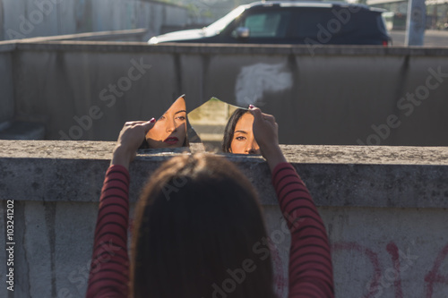 Beautiful girl posing in an urban context