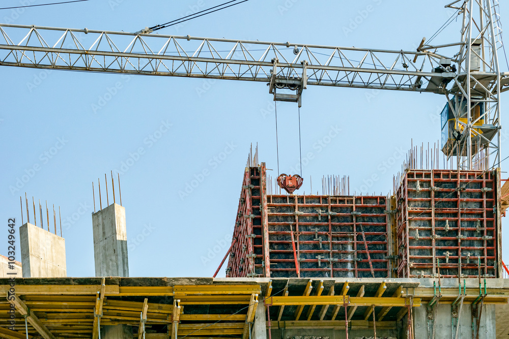 Building under construction and crane. Building under construction and crane.